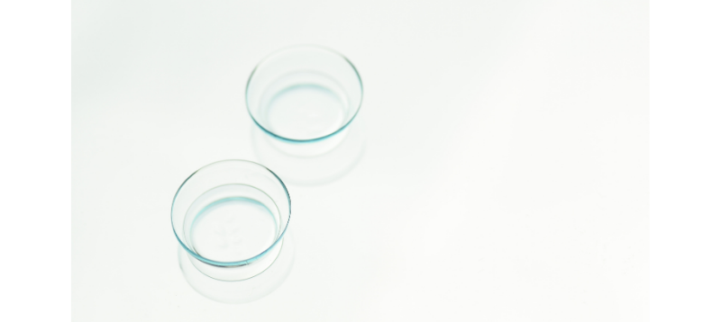 a set of contact lenses lying out