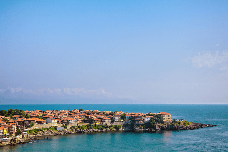 A view of the clay roofed town of Sozopol beside the blue-green water of the black Sea