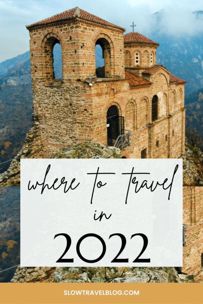Pinterest Pin reads "where to travel in 2022" over a background photo of a ruined church on top of a mountain in Bulgaria