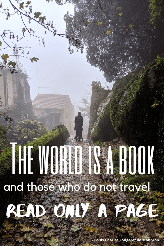 A man in a trench coat pushes a stroller down a misty, leaf covered alley in Sintra Portugal. A mossy wall sits on the left and huge mossy rocks to the right. Quote reads "The world is a book, and those who do not travel read only a page." - Louis Charles Fougeret de Monbron