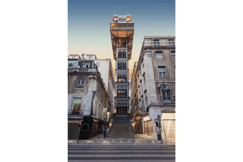 Santa Justa Lift - an eiffel inspired steel elevator in central Lisbon at dusk in winter with nobody around
