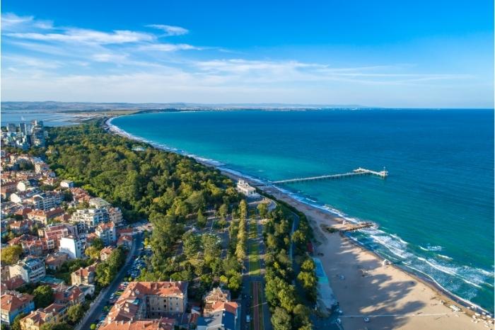 Burgas from the air. The long Sea Garden is green and lush beside the white sandy beach running along the Black Sea Coast in Bulgaria.