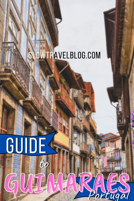 Guide to Guimaraes written over a photo of a colorful street in Portugal