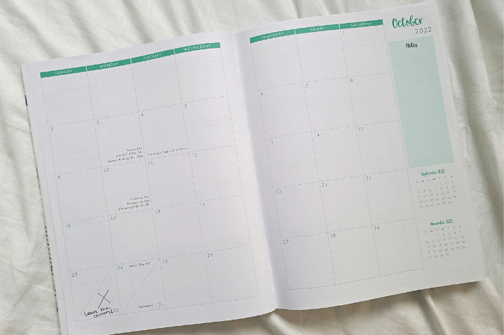 Day planner calendar open to the month of October with the 30th marked as "Leave the country" - the deadline to get rid of everything