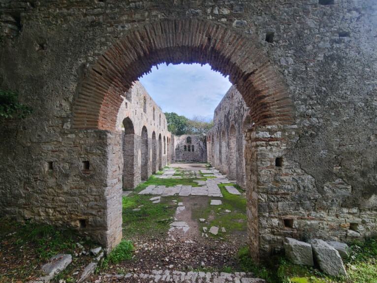 The Great Basilica at Butrint National Park. A ruined church with two storey standing archways.