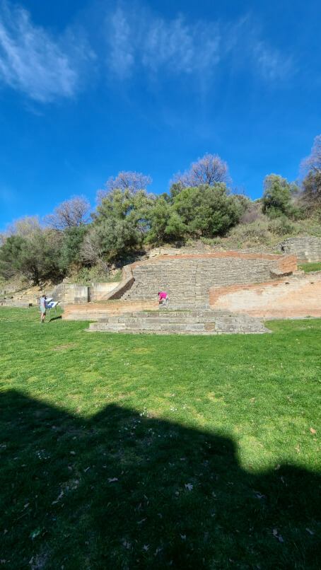 Remains of ancient theatre seats in the hill at Apollonia