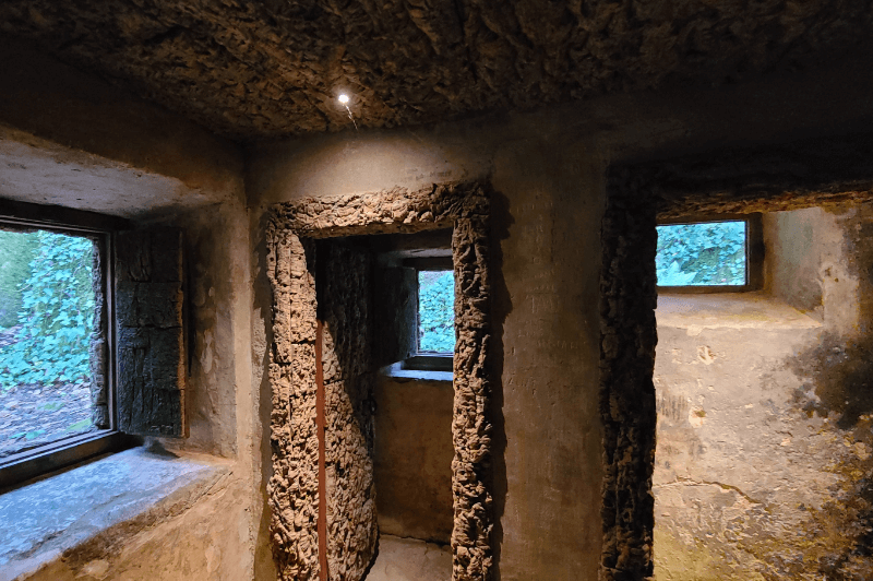 The Upper Room at Convent of the Capuchos features three windows lined with cork