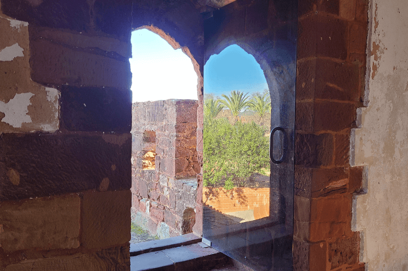 Silves Castle with the outside reflecting on an open door